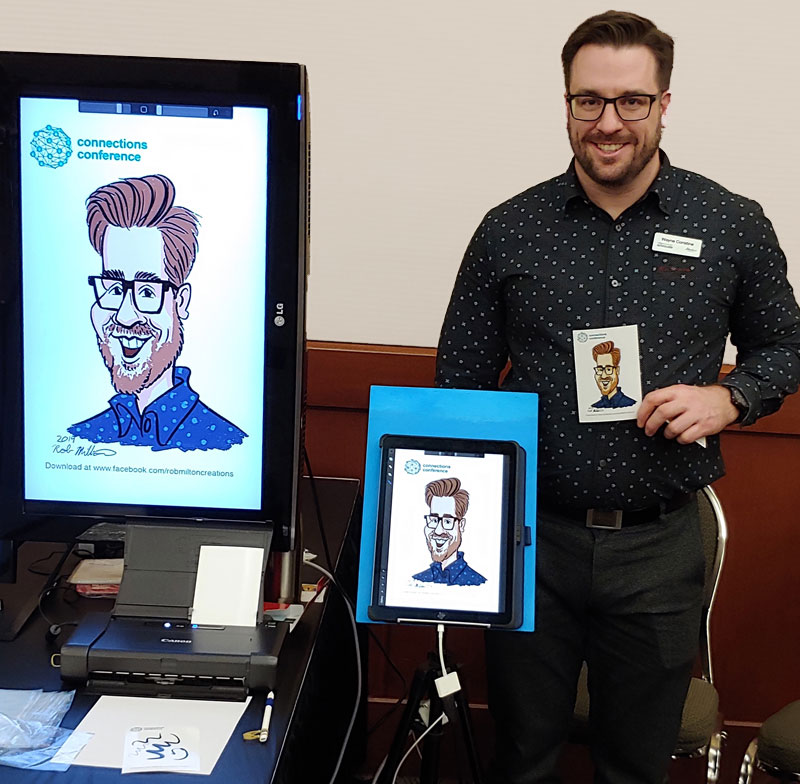 Man showing his coloured caricature at networking event